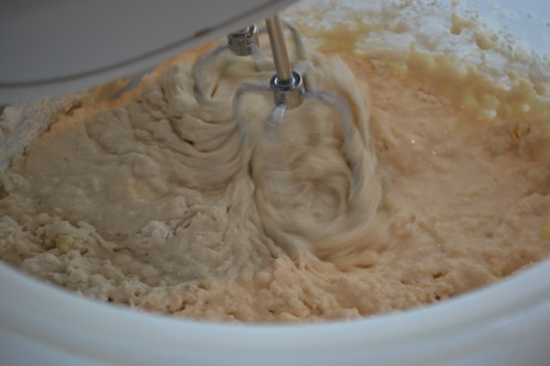 Mixing ingredients together with hand mixer.