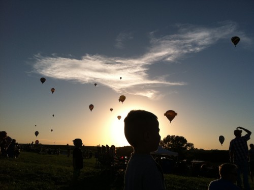 Silhouettes of Matthew and Lincoln studying the northwestern sky.