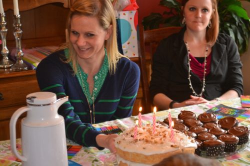 Molly asking for help in blowing out her candles.