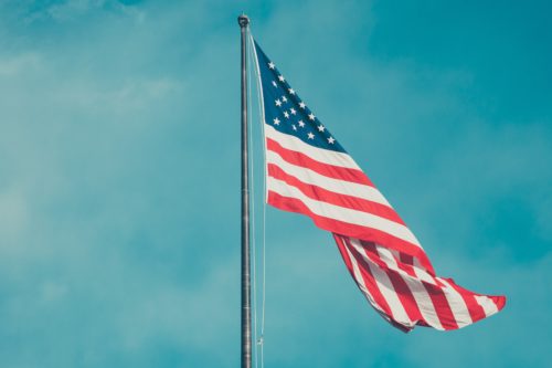American flag fluttering in sky http://barnimages.com/