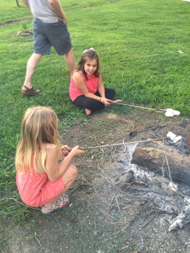 Addie and Ava roasting marshmallows