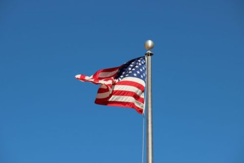 american-flag-pole-blue-sky-720x480